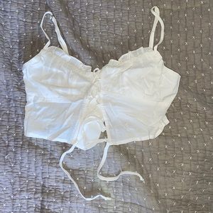 never been worn white crop top with ruffles at the top, size S